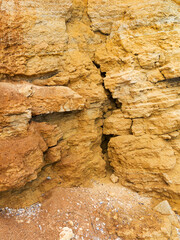 Desert landscape with multi-colored yellow, green and blue clay deposits of minerals in geological formations