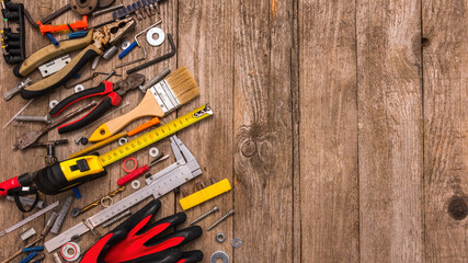 A set of hand-held, dusty tools with space for text.