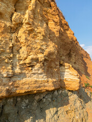Mountain landslide disaster in sesmically dangerous area. Large cracks in earth, descent of large layers of earth blocking road. Mortal danger of damming people at foot of landslide slopes of mountain