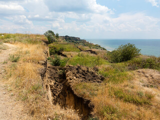 Mountain landslide disaster in sesmically dangerous area. Large cracks in earth, descent of large...
