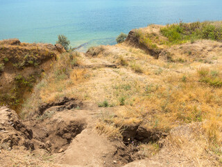 Mountain landslide disaster in sesmically dangerous area. Large cracks in earth, descent of large...
