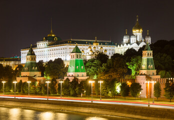 Obraz premium The Moscow Kremlin in evening. Embankment, towers, temples, car traces