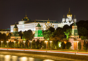 The Moscow Kremlin in evening. Embankment, towers, temples, car traces