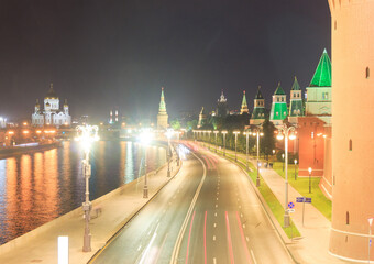 The Moscow Kremlin in evening. Embankment, towers, temples, car traces. Christ the Saviour...