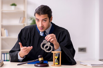 Young male judge in time management concept