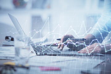 Double exposure of woman hands typing on computer and forex chart hologram drawing. Stock market invest concept.