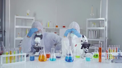 Stressed unsuccessful western scientists couple working failed on test tube to analysis and develop vaccine of covid-19 virus in lab or laboratory in technology medical, chemistry, healthcare.