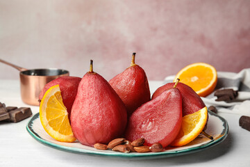 Delicious mulled wine poached pears served on table - obrazy, fototapety, plakaty