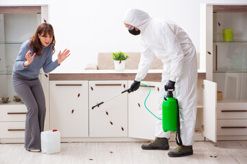 Young male contractor and female client during pest control