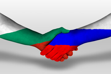 Handshake between russia and bulgaria flags painted on hands, illustration with clipping path.