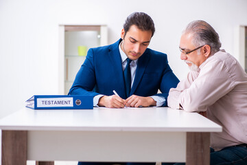 Young male lawyer visiting old man in testament concept