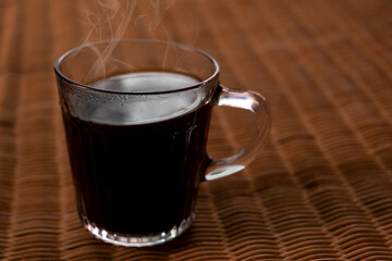 Americano coffee on rattan table top