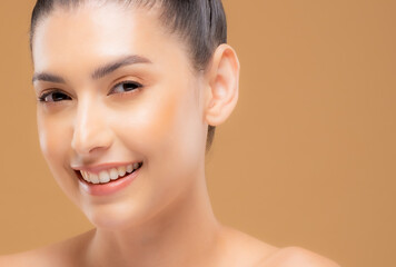 Beautiful woman with healthy skin with a brown background. Take care of your skin by spa course. Smile face