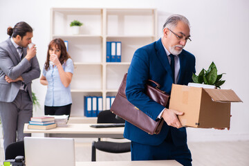 Two male and one female employees working in the office