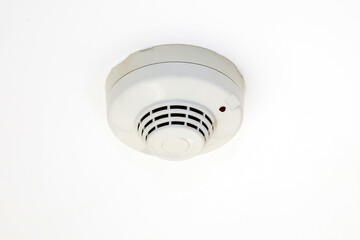 close-up ceiling mounted smoke detector in the building concepts of fire alarm prevention and safety system.