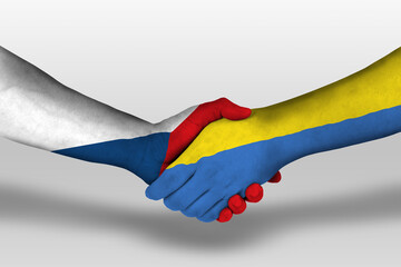 Handshake between ukraine and czech republic flags painted on hands, illustration with clipping path.