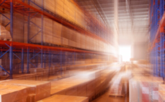 Blurred Warehouse inventory cargo storage in warehousing. Business and Industrial logistics background.

