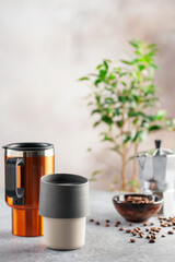 Reusable coffee mug  on a bright background. Healthy break. Reusable ware. Zero waste concept