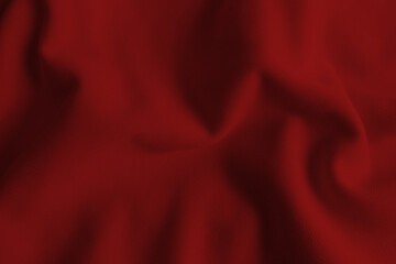 Red abstract wavy clothes background. fabric texture