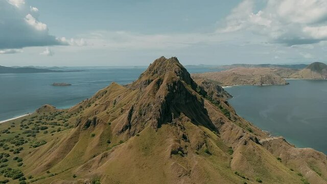 Padar island.pink beach.Wild islands of Indonesia. Flores. tropical paradise. Labuan Baggio. drone shooting. Wild beaches, blue logons, coral reefs, green hills. aerial view. boat trip safari. 