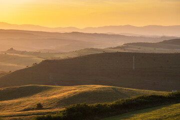 rolling hills in autumn sunset nature background