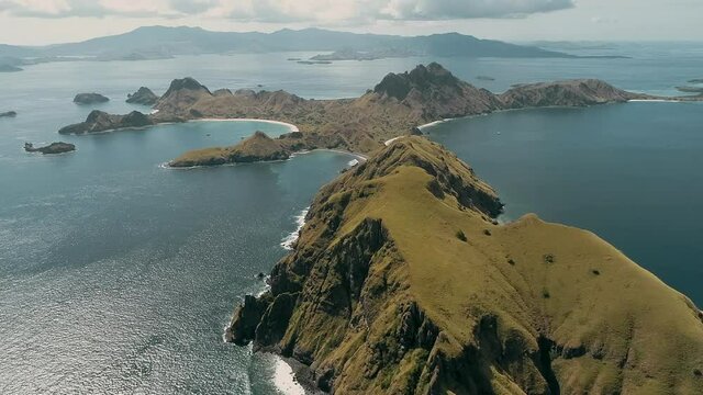 Padar island.pink beach.Wild islands of Indonesia. Flores. tropical paradise. Labuan Baggio. drone shooting. Wild beaches, blue logons, coral reefs, green hills. aerial view. boat trip safari. 