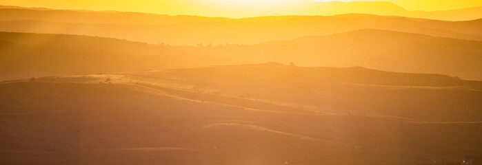 rolling hills in autumn sunset nature background