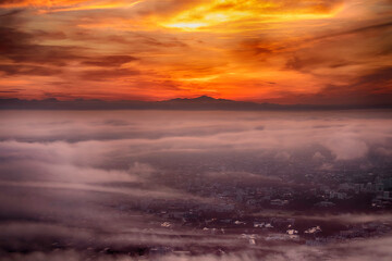 
Chiang Mai city in Thailand is covered with mist, the morning sun shines.