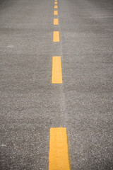 Empty asphalt road with yellow line surface background. Abstract life journey travel or goal life concept.