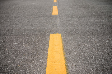 Empty asphalt road with yellow line surface background. Transportation, abstract life journey...