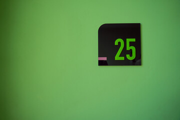 Number 25 on the light green floor in the building