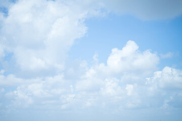 sky on a day with many clouds floats high, causing less light to flow down