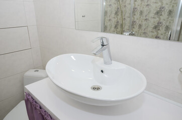 white sink in the bathroom. Close-up.