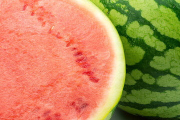 Watermelon close-up whole and half background.