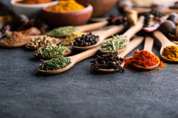 spices and herbs beautifully on a rustic background
