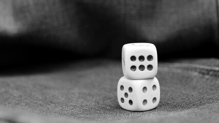 cube playing on a jeans, black and white image