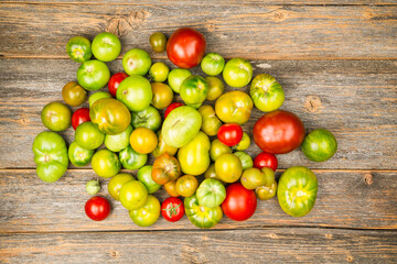 Heap of tomatoes on a wooden table