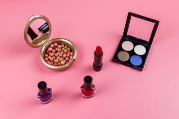 Obraz na płótnie Canvas Set of decorative cosmetics on a pink background. Flat lay
