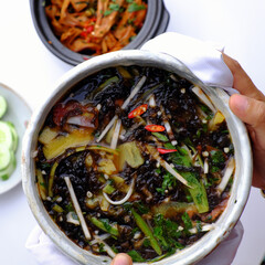sour vegetables soup bowl for vegan meal from nutrition ingredient food as seaweed, bamboo shoot, tomato, okra, pine apple