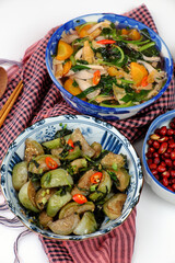 vegan daily meal for lunch time, fried peanut with sauce, fried green round eggplant, rice bowl, vegetables soup, simple vegetarian Vietnamese food