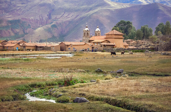 Rural countryside landscape with the small village of Raqchi and its church standing out. This town is famous for its inca archaeological site. Altiplano, Peru, South America