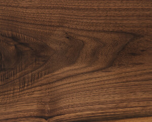 Texture of black walnut board with oil finish
