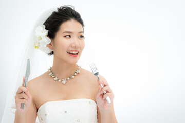 ナイフとフォークを持った花嫁