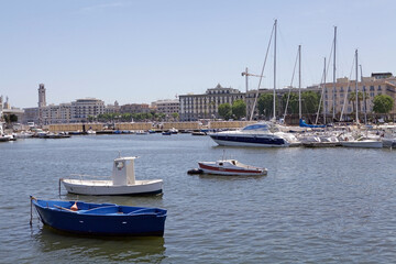Fototapeta na wymiar Boats and seafront at Bari, Apulia, Italy. Bari is the capital city of Apulia region on the Adriatic sea