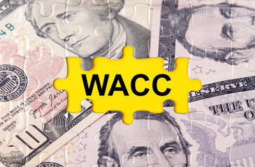 Puzzle with the image of dollars in the center of the inscription -WACC