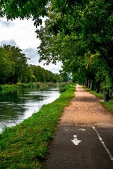 The Kembs canal, in Alsace, France, and its parallel bike path leading to Saint Louis