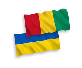 Flags of Guinea and Ukraine on a white background