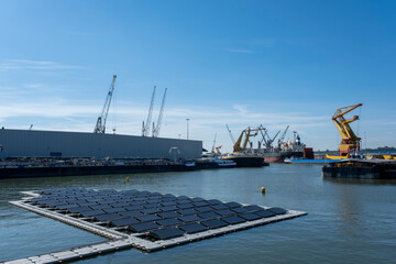 Fototapeta premium solar panel Floating in a harbour. Used to produce electricity in a clean technology concept