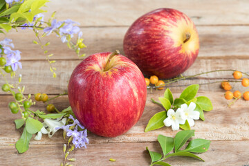 background texture super fruits red apple healthy foods for diet with flower arrangement flat lay style on wooden