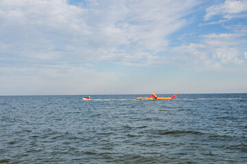 inflatable dragon on sea water on a clear day